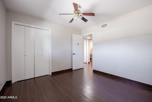1551 E Glencove St, Mesa, AZ 85203 - unfurnished bedroom with dark wood-style flooring, a closet, and a ceiling fan