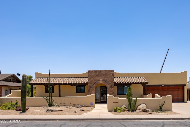 1551 E Glencove St, Mesa, AZ 85203 - southwest-style home with a fenced front yard, stucco siding, an attached garage, and concrete driveway