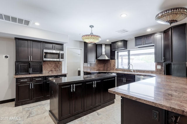 1551 E Glencove St, Mesa, AZ 85203 - kitchen featuring stainless steel appliances, wall chimney exhaust hood, a center island, recessed lighting, and dark stone counters