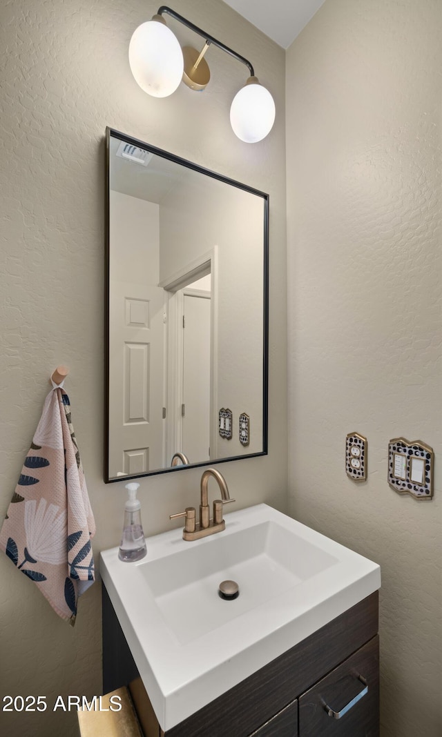 10224 E Talameer Ave, Mesa, AZ 85212 - bathroom with vanity and a textured wall