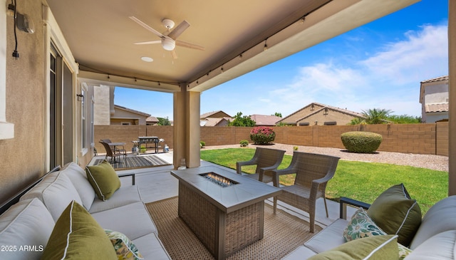 10224 E Talameer Ave, Mesa, AZ 85212 - fenced backyard with an outdoor living space with a fire pit, a patio area, and a ceiling fan