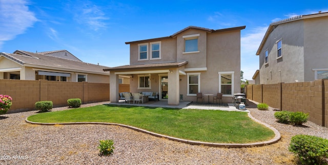 10224 E Talameer Ave, Mesa, AZ 85212 - back of house featuring stucco siding, an outdoor hangout area, and a patio
