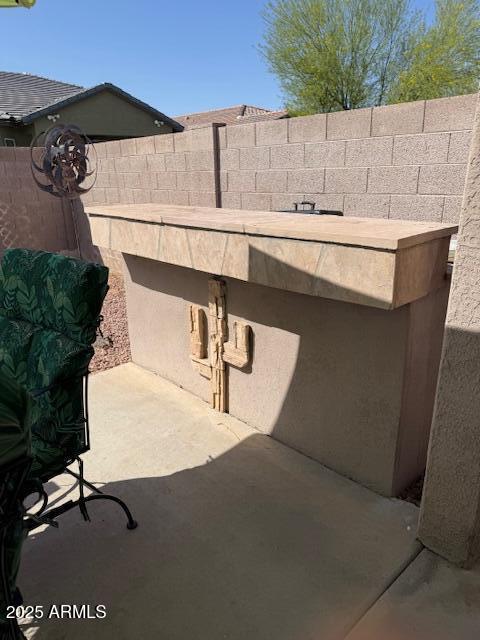 view of patio / terrace featuring fence