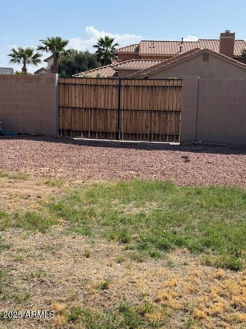 view of yard featuring a gate and fence