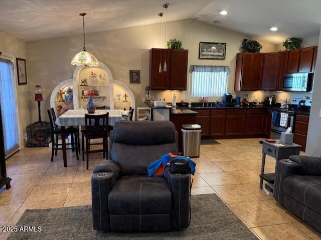 living room with light tile patterned flooring, high vaulted ceiling, and recessed lighting