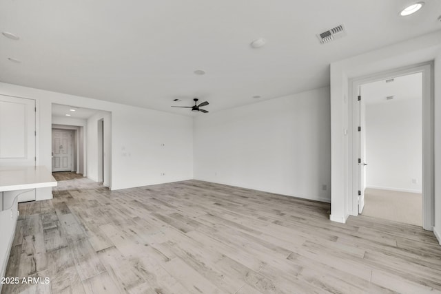 4128 Desert Moon Dr, Wickenburg, AZ 85390 - spare room with light wood-style floors, ceiling fan, recessed lighting, and baseboards