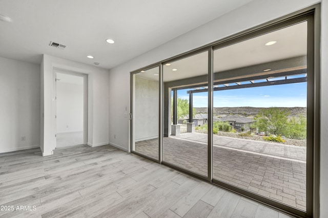 4128 Desert Moon Dr, Wickenburg, AZ 85390 - spare room featuring wood finished floors, recessed lighting, and baseboards