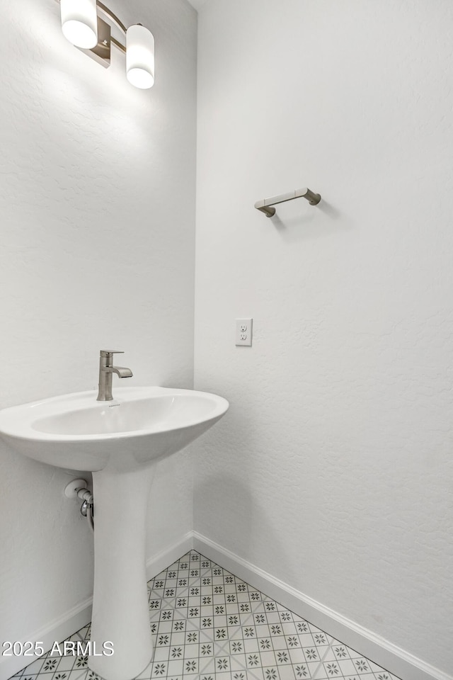 4128 Desert Moon Dr, Wickenburg, AZ 85390 - bathroom with baseboards, tile patterned floors, and a sink