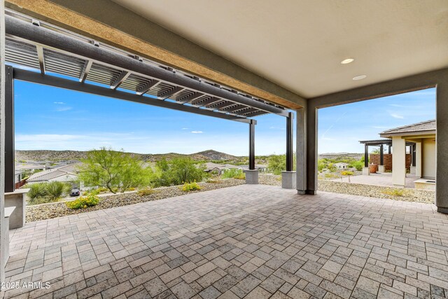 4128 Desert Moon Dr, Wickenburg, AZ 85390 - view of patio / terrace with a pergola and a mountain view