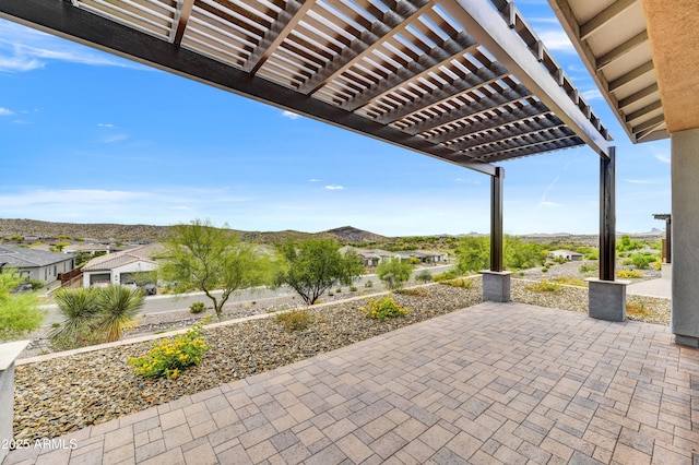 4128 Desert Moon Dr, Wickenburg, AZ 85390 - view of patio / terrace with a pergola and a mountain view