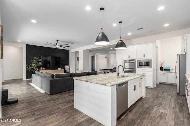 kitchen featuring white cabinets, light stone countertops, sink, and appliances with stainless steel finishes