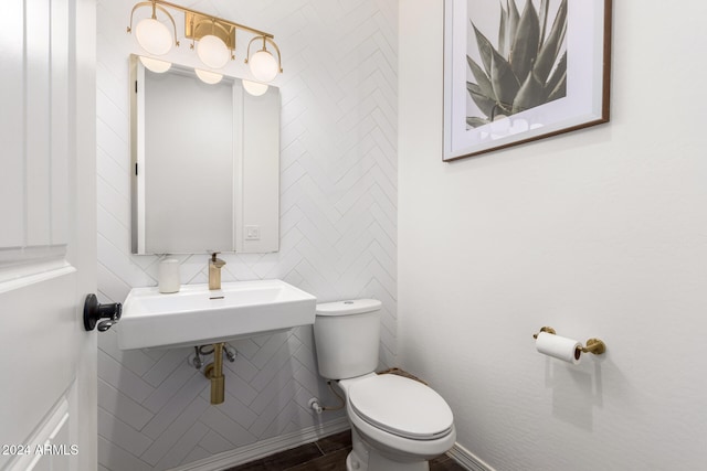 bathroom featuring toilet and tasteful backsplash