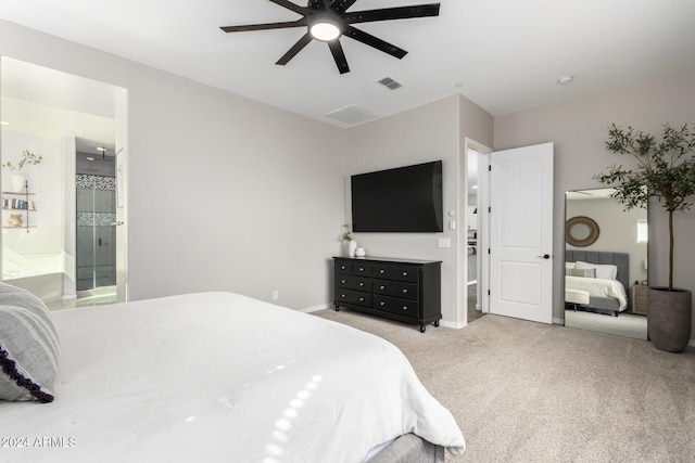 carpeted bedroom featuring ceiling fan and ensuite bathroom