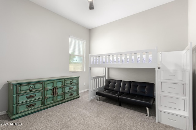 bedroom featuring light colored carpet and ceiling fan