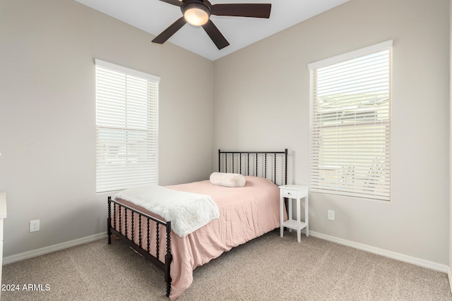 carpeted bedroom featuring ceiling fan