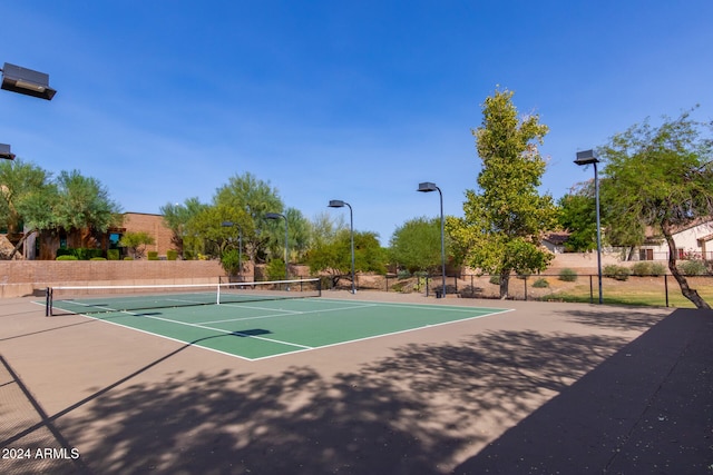 view of sport court featuring basketball hoop