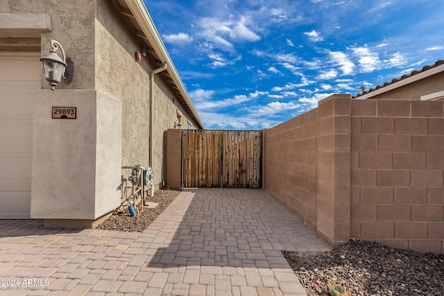 view of patio / terrace featuring a garage