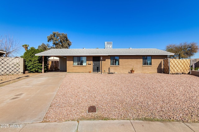 ranch-style house with a carport