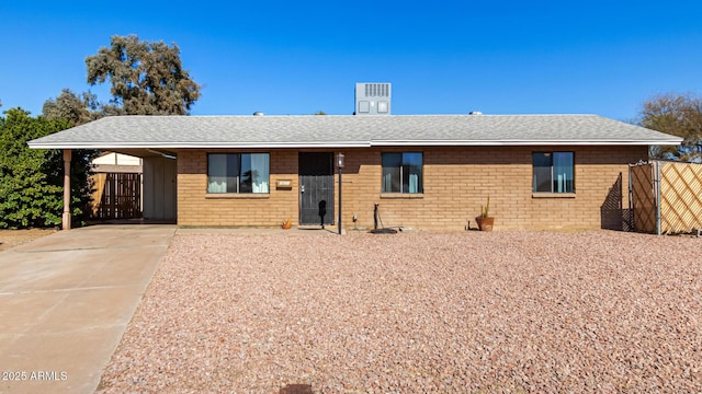 ranch-style house featuring a carport