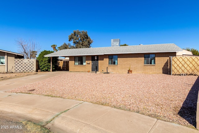 single story home with a carport