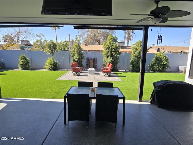 view of patio with grilling area and ceiling fan