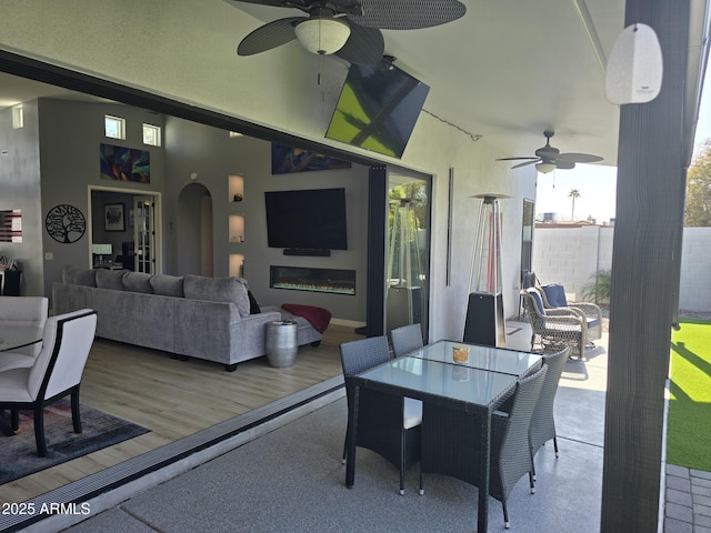 exterior space with an outdoor hangout area, ceiling fan, and a deck