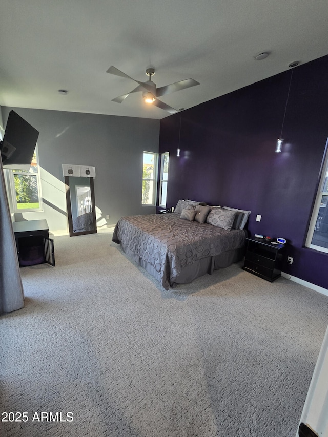 unfurnished bedroom with ceiling fan and carpet