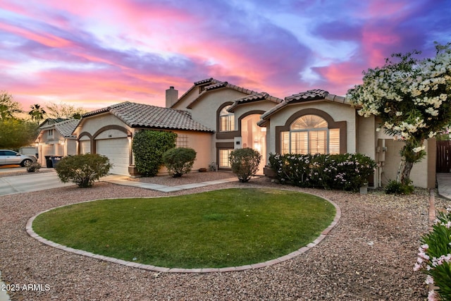 1146 W Sea Fog Dr, Gilbert, AZ 85233 - mediterranean / spanish house featuring stucco siding, curved driveway, a chimney, an attached garage, and a tile roof