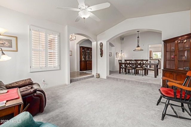 1146 W Sea Fog Dr, Gilbert, AZ 85233 - carpeted living room with arched walkways, vaulted ceiling, and ceiling fan