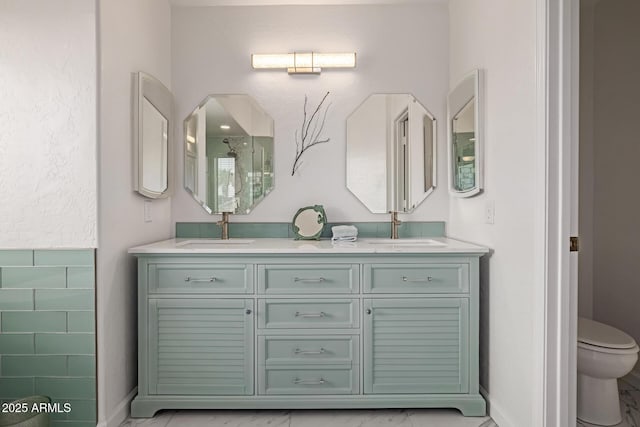 1146 W Sea Fog Dr, Gilbert, AZ 85233 - full bathroom with toilet, double vanity, baseboards, and marble look tiles