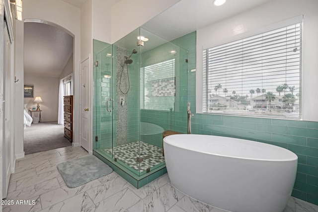 1146 W Sea Fog Dr, Gilbert, AZ 85233 - full bath with a shower stall, a freestanding tub, marble look tiles, and tile walls