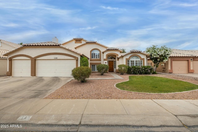 1146 W Sea Fog Dr, Gilbert, AZ 85233 - view of front of home featuring an attached garage, concrete driveway, stucco siding, a tiled roof, and a front lawn