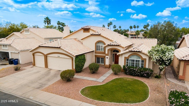 1146 W Sea Fog Dr, Gilbert, AZ 85233 - mediterranean / spanish-style house with an attached garage, stucco siding, concrete driveway, a tiled roof, and a chimney