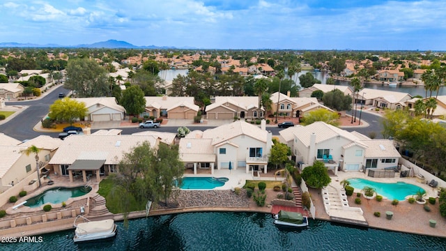 1146 W Sea Fog Dr, Gilbert, AZ 85233 - aerial view of residential area featuring a pool and a water and mountain view
