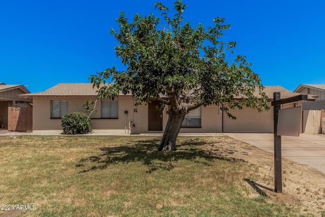 7359 N 39th Ave, Phoenix, AZ 85051 - view of front of home with driveway, an attached garage, and a front lawn