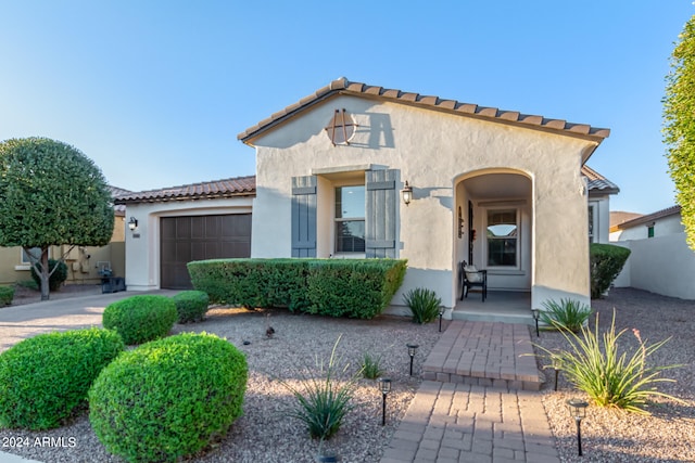 view of front of property with a garage