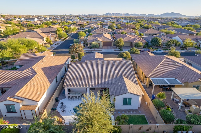 birds eye view of property with a mountain view