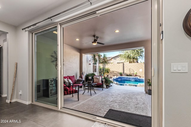 doorway to outside with heating unit and ceiling fan