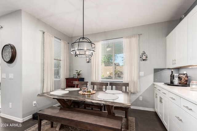 dining space featuring an inviting chandelier