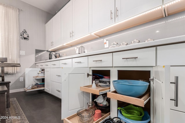 kitchen featuring white cabinets