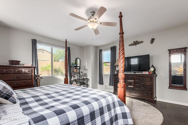 tiled bedroom featuring ceiling fan