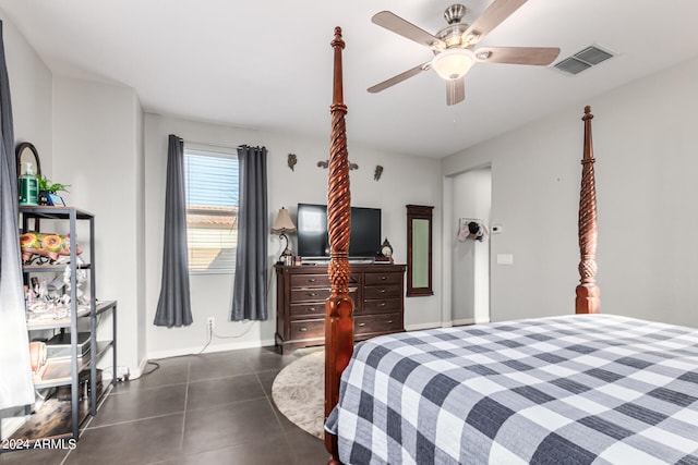 bedroom featuring dark tile patterned floors and ceiling fan