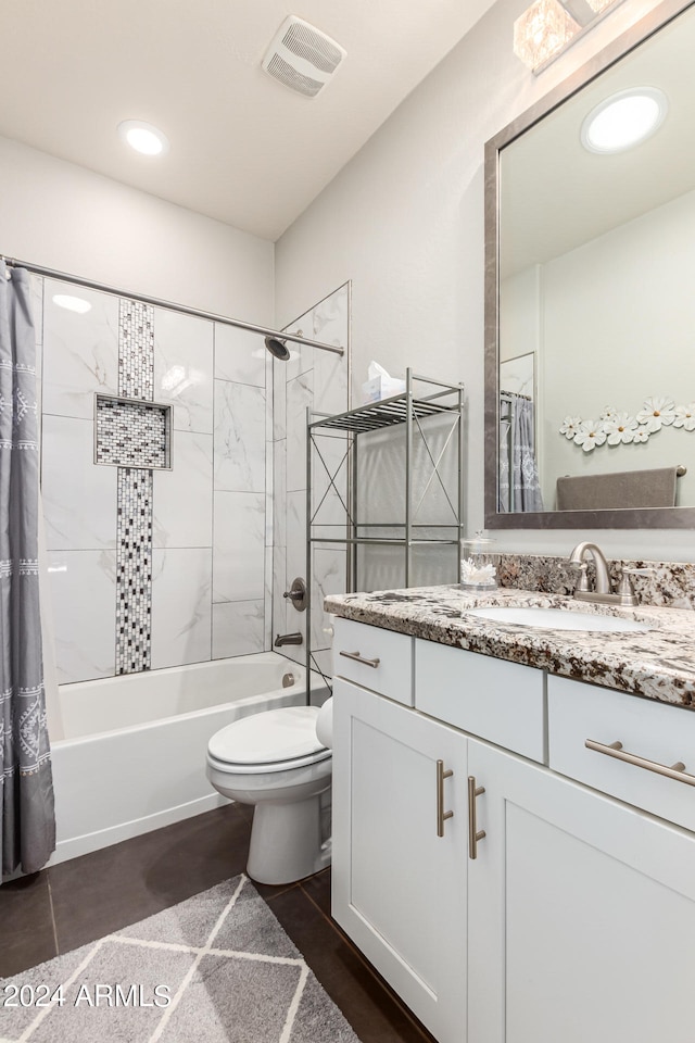 full bathroom featuring shower / bath combo, vanity, and toilet