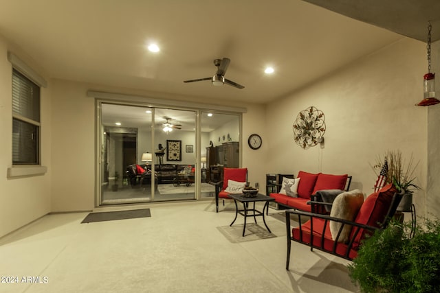 living area featuring ceiling fan