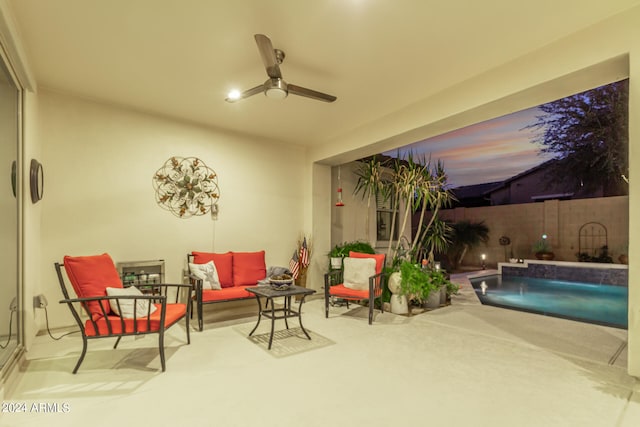 interior space featuring ceiling fan, outdoor lounge area, and pool water feature