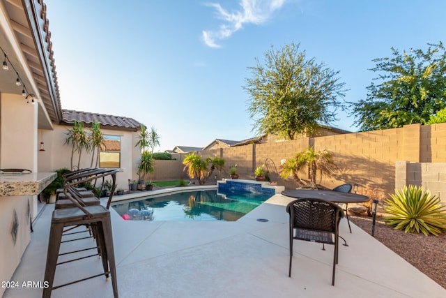 view of pool featuring a patio area