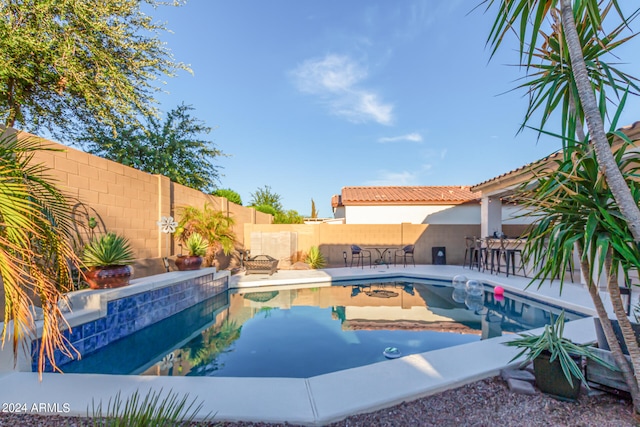 view of swimming pool with a patio