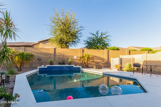 view of swimming pool featuring a patio area