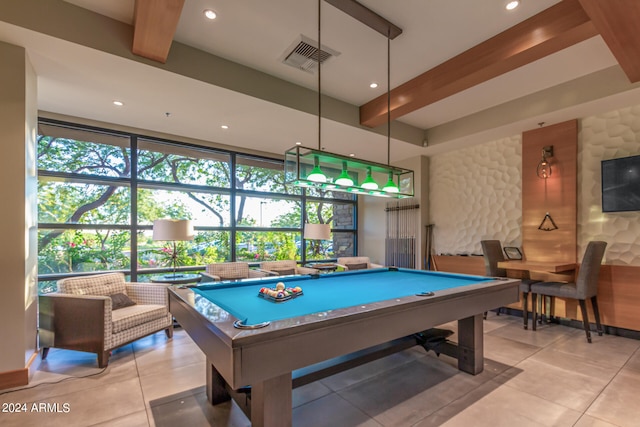 playroom with light tile patterned floors, beamed ceiling, and pool table