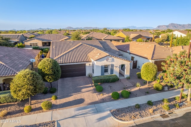 birds eye view of property with a mountain view